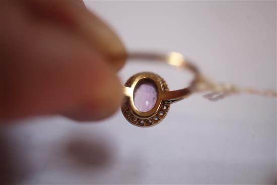 A gold, pink topaz and diamond oval cluster ring, size P.